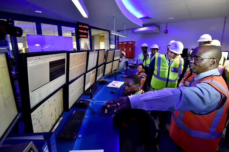 President Jacob Zuma is taken on a tour of the control centre of Medupi Power Station Unit 6 by team Dynamic Manager Sakkie Thulare. - Note the sunglasses. Is this irony?