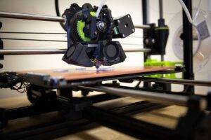 Subtractive vs Additive Manufacturing - A three dimensional (3D) printer creates a model in the Marine Warrior Library